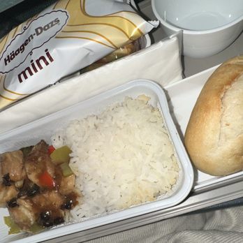 Cathay Pacific - Filling Dinner: Pork and rice. - Airlines Near Me - San Francisco, California Cathay Pacific - Filling Dinner: Pork and rice. - Airlines Near Me - San Francisco, California