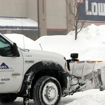 Princeton Scapes - a snow plow in front of a store - Landscaping Near Me - Sterling, Massachusetts