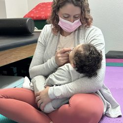 Wonderkind Pediatric Therapy - Katy Schneider PT, DPT giving much earned snuggles after doing hard work.