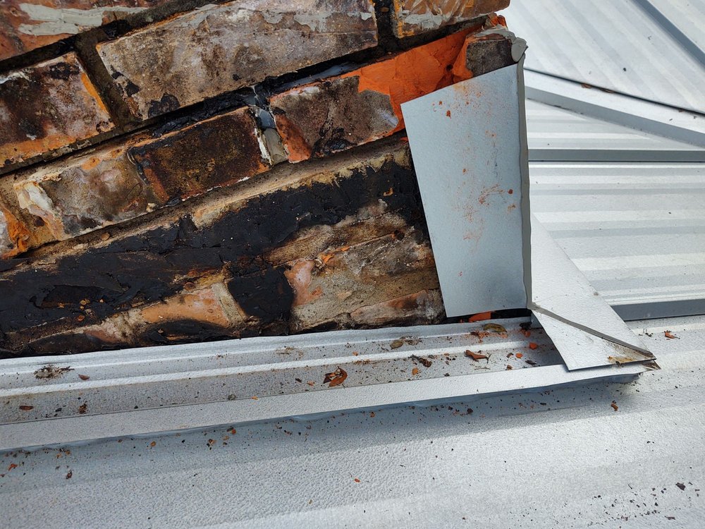 Slide of T-Roy's Relief Roofing