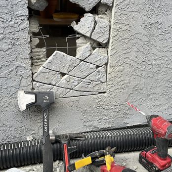 Guevara's Builders - Process of creating opening for garage vent installation over stucco wall. - General Contractors Near Me - Chula Vista, California Guevara's Builders - Process of creating opening for garage vent installation over stucco wall. - General Contractors Near Me - Chula Vista, California