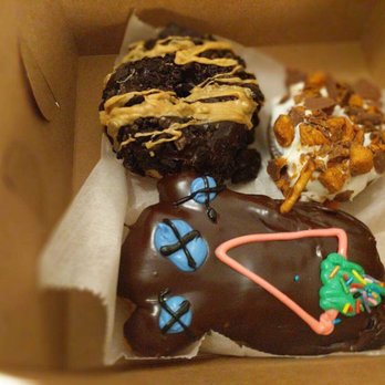 Voodoo Doughnut - Oreo and something, Butterfinger and something and Voodoo Doll Doughnut (my personal favorite). - Donuts Near Me - Austin, Texas