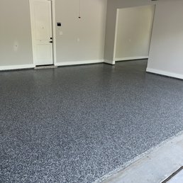 Three car garage with new gray base coat and gray, black and white flakes and poly coating. Three car garage with new gray base coat and gray, black and white flakes and poly coating.