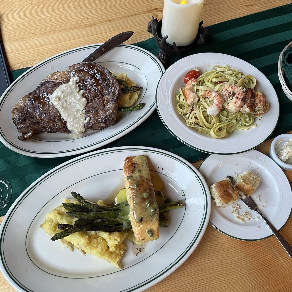 Bear Track Inn - Salmon with capers in a lemon sauce, rib eye with a blue cheese horseradish sauce, spotted prawns with pesto - Hotels Near Me