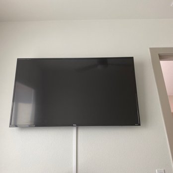 Audio Visual Up - 55 inch tv mounted with added cable concealer done in an apartment. - Home Theatre Installation Near Me