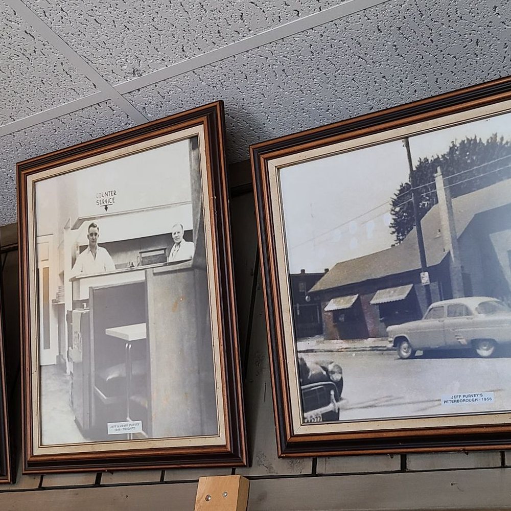 Jeff Purvey's - a row of framed photographs on a wall - Seafood Near Me - Peterborough, Ontario Jeff Purvey's - a row of framed photographs on a wall - Seafood Near Me - Peterborough, Ontario