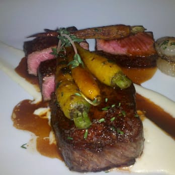 The Raymond 1886 - Butter Roasted New York Steak-Sweet cippolini puree, roasted root vegetables and the flavor of bacon - New American Near Me - Pasadena, California The Raymond 1886 - Butter Roasted New York Steak-Sweet cippolini puree, roasted root vegetables and the flavor of bacon - New American Near Me - Pasadena, California