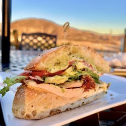 Robert Renzoni Vineyards - Chicken Club $28 - Marinated chicken, crispy prosciutto, provolone, pesto, garlic aioli, tomato, spring mix and avocado