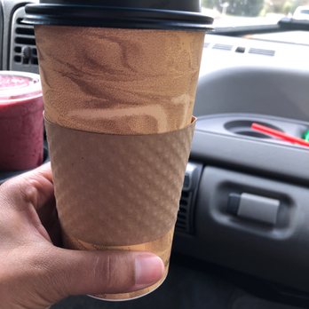 Marcel’s Drive-Thru - ows a hand holding a coffee cup - Coffee & Tea Near Me - Clearlake Oaks, California