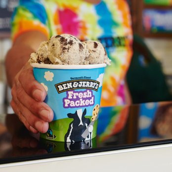 Ben & Jerry’s - Scooper handing a fresh packed pint over the counter at a Ben & Jerry's ice cream shop. - Ice Cream & Frozen Yogurt Near Me - Boston, Massachusetts Ben & Jerry’s - Scooper handing a fresh packed pint over the counter at a Ben & Jerry's ice cream shop. - Ice Cream & Frozen Yogurt Near Me - Boston, Massachusetts