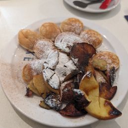 Poffertjes with apple cinnamon topping Poffertjes with apple cinnamon topping