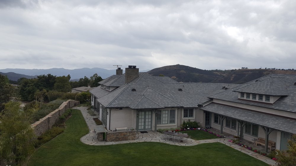 Slide of CJ West Roofing