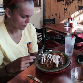 Oscar's Cafe - My daughter contemplates her huge breakfast burrito - Mexican Near Me - Springdale, Utah