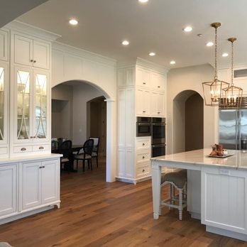Hersh & Son Construction - a kitchen with white cabinets and wood floors - General Contractors Near Me - Pilot Hill, California Hersh & Son Construction - a kitchen with white cabinets and wood floors - General Contractors Near Me - Pilot Hill, California
