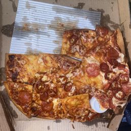 A disheveled pizza.... A disheveled pizza....