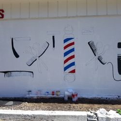 Jimmy Johnson Barber Shop - His granddaughter Dayla Johnson designed it drew it then painted it she was just in 9 grade I think but to free hand it she did great