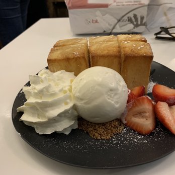 Spot Dessert Bar - Toast w/ drizzled honey over top scoop of ice cream, graham cracker crumbs, whipped cream and strawberries. - Desserts Near Me - New York, New York