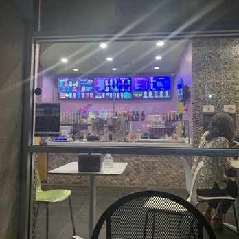The Berry Bar - a woman sitting at a table - Ice Cream & Frozen Yogurt Near Me - Houston, Texas