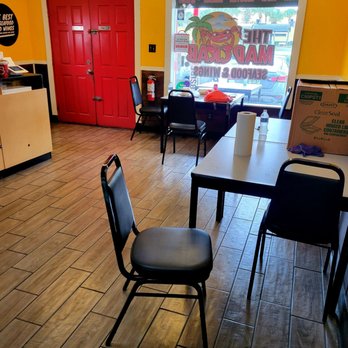 Mad Crab Seafood - Sept 2021: Approx two tables inside. Take-out is BIG here - Seafood Near Me - Orlando, Florida