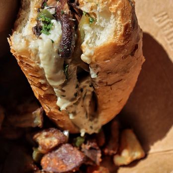 Decibel Coffee Works - Vegan cheesesteak and a side of potatoes with ranchero sauce - Coffee & Tea Near Me - Tucson, Arizona Decibel Coffee Works - Vegan cheesesteak and a side of potatoes with ranchero sauce - Coffee & Tea Near Me - Tucson, Arizona