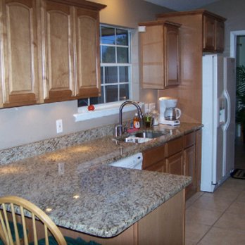 Done Right Contracting - a kitchen with granite counter tops - General Contractors Near Me - Palm Bay, Florida Done Right Contracting - a kitchen with granite counter tops - General Contractors Near Me - Palm Bay, Florida