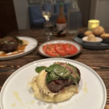 Dovetail - Filet Mignon with spinach salad garnish - Southern Near Me - Macon, Georgia