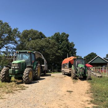 BJ Reece Orchards - Tractors at the entrance to the second orchard. - Fruits & Veggies Near Me - Ellijay, Georgia