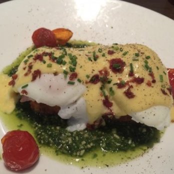 Panzano - Panzano eggs Benedict on a polenta cake with prosciutto hollandaise and pesto - Italian Near Me - Denver, Colorado Panzano - Panzano eggs Benedict on a polenta cake with prosciutto hollandaise and pesto - Italian Near Me - Denver, Colorado