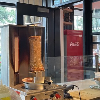 Greek Grotto - a pita being cooked in a commercial kitchen - Greek Near Me - Honolulu, Hawaii Greek Grotto - a pita being cooked in a commercial kitchen - Greek Near Me - Honolulu, Hawaii