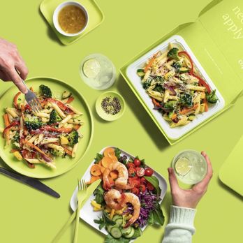 Cōpow - a person eating a salad with shrimp and vegetables - Food Delivery Services Near Me Cōpow - a person eating a salad with shrimp and vegetables - Food Delivery Services Near Me