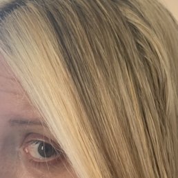This is what my hair looks like now AFTER SHE TRIED TO FIX IT. A giant white and orange skunk stripe.