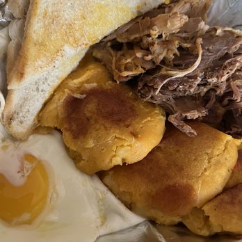 Chimborazo - Llapingachos Breakfast (to go, the 2nd egg and side of aji crillo are under the bread) - Latin American Near Me - Saint Paul, Minnesota