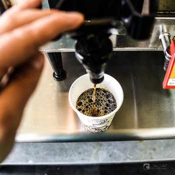 Westfield Market & Deli - a person filling a cup of coffee - Grocery Near Me - Bronx, New York Westfield Market & Deli - a person filling a cup of coffee - Grocery Near Me - Bronx, New York
