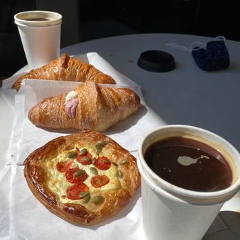 Petit Pierre Bakery - Goat cheese pastry, honey whip and raspberry croissant, regular croissant, americano - Bakeries Near Me - Seattle, Washington