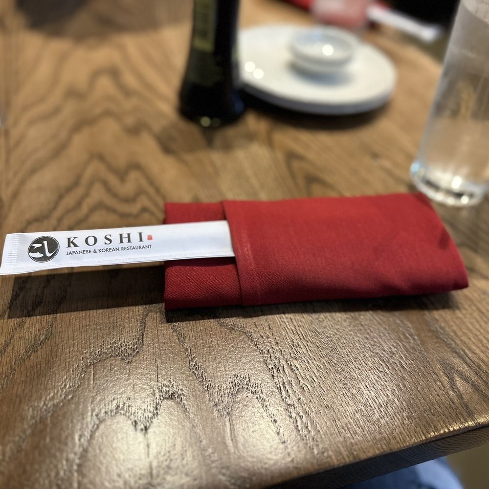 Koshi Sushi & Korean - a red napkin on a wooden table - Sushi Bars Near Me - McKinney, Texas Koshi Sushi & Korean - a red napkin on a wooden table - Sushi Bars Near Me - McKinney, Texas