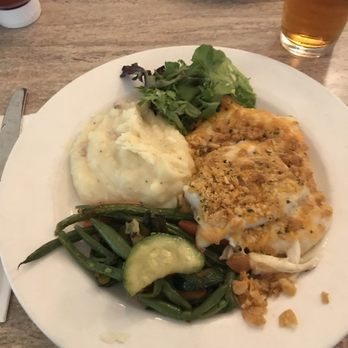 The Meadowbrook Restaurant - Baked scrod Nantucket with a side of mashed potatoes and mixed vegetables. - American Near Me - Hanson, Massachusetts
