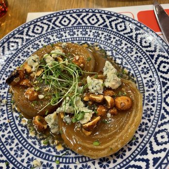 La Barra at Mercado Little Spain - Roasted onions with blue cheese and hazelnuts - Spanish Near Me - New York, New York La Barra at Mercado Little Spain - Roasted onions with blue cheese and hazelnuts - Spanish Near Me - New York, New York