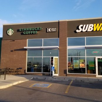 Starbucks - a car parked in front of a coffee shop - Coffee & Tea Near Me - Calgary, Alberta Starbucks - a car parked in front of a coffee shop - Coffee & Tea Near Me - Calgary, Alberta