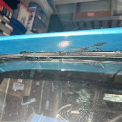 Showcase Collision Specialists - Destroyed weatherstripping and sealant all over the place, the car was delivered to me this way