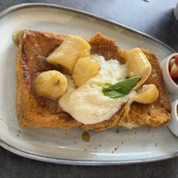 Banana French toast with the strawberries and granola on the side.