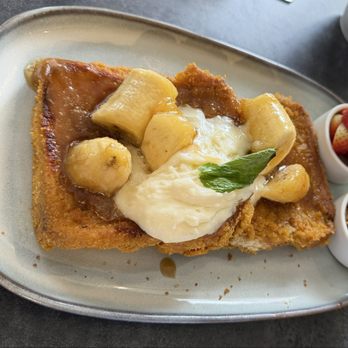 Mawa's Kitchen - Banana French toast with the strawberries and granola on the side. - New American Near Me - Aspen, Colorado