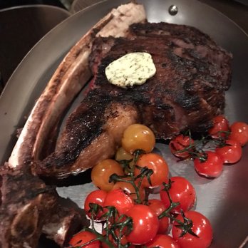 LOUIX LOUIS - Tomahawk - with a pat of butter and some veggies - Cocktail Bars Near Me - Toronto, Ontario LOUIX LOUIS - Tomahawk - with a pat of butter and some veggies - Cocktail Bars Near Me - Toronto, Ontario