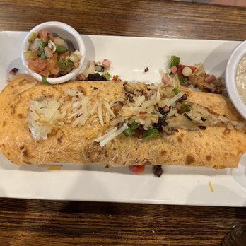 Snake River Grill - Breakfast burrito with a side of gravy - Steakhouses Near Me - Hagerman, Idaho Snake River Grill - Breakfast burrito with a side of gravy - Steakhouses Near Me - Hagerman, Idaho