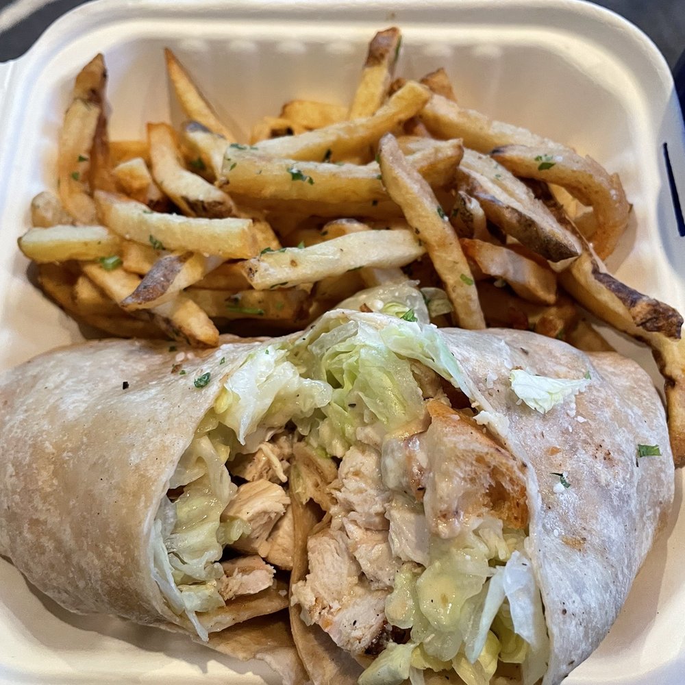 Flagship Tavern and Grill - Chicken Caesar Wrap with Fresh Cut Fries - American Near Me - Chicago, Illinois Flagship Tavern and Grill - Chicken Caesar Wrap with Fresh Cut Fries - American Near Me - Chicago, Illinois