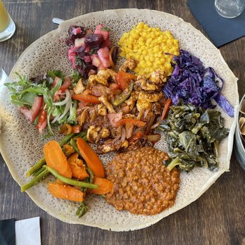 Mela Bistro - veggie platter and spicy chicken tibs - Ethiopian Near Me - Oakland, California Mela Bistro - veggie platter and spicy chicken tibs - Ethiopian Near Me - Oakland, California