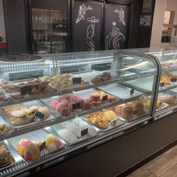 Mariachi Bakery - Pan dulce display case.. great assortment.. - Bakeries Near Me - Norwalk, California