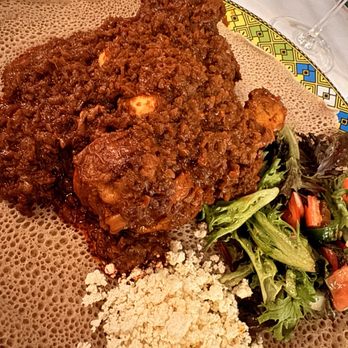 Enjera Restaurant - Zigni D Erho - chicken, boiled egg, fresh greens and a spicy sauce - Ethiopian Near Me - Arlington, Virginia Enjera Restaurant - Zigni D Erho - chicken, boiled egg, fresh greens and a spicy sauce - Ethiopian Near Me - Arlington, Virginia