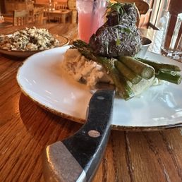 Bison tenderloin over mashed potatoes and asparagus with wild rice and huckleberry lemonade