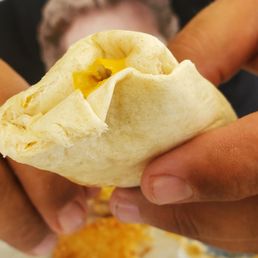 a man eating a burrito a man eating a burrito