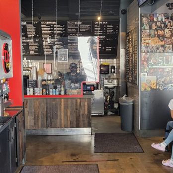 Bad-Ass Breakfast Burritos - a woman sitting on a trash can - Breakfast & Brunch Near Me - Northridge, California